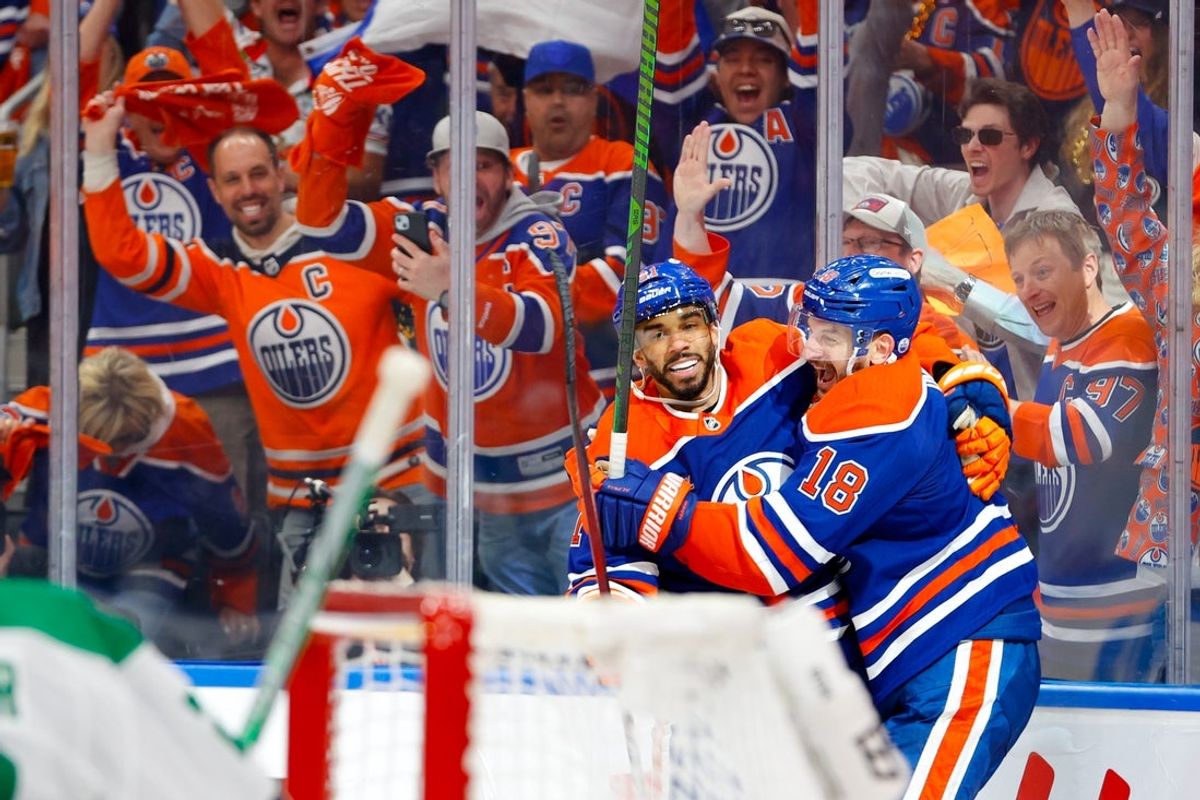 May 25, 2025; Edmonton, Alberta, CAN; Edmonton Oilers left wing Evander Kane (91) and left wing Zach Hyman (18) celebrates a goal scored by Hyman against the Dallas Stars during the third period in game three of the Western Conference Final of the 2025 Stanley Cup Playoffs at Rogers Place. Mandatory Credit: Perry Nelson-Imagn Images