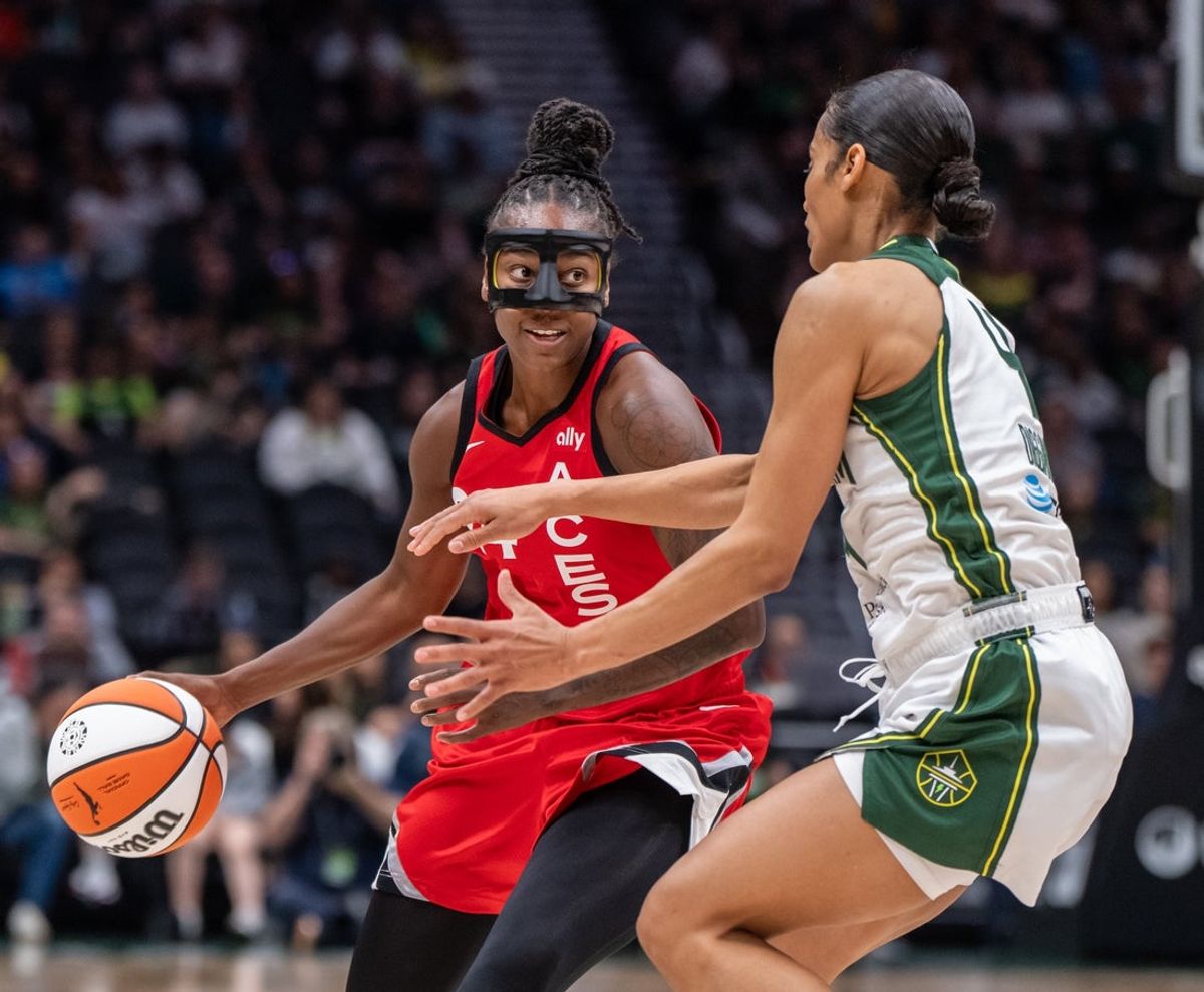 May 25, 2025; Seattle, Washington, USA;  Las Vegas Aces guard Jewell Loyd (24) dribbles the ball against Seattle Storm guard Skylar Diggins (4) during the first half at Climate Pledge Arena. Mandatory Credit: Stephen Brashear-Imagn Images