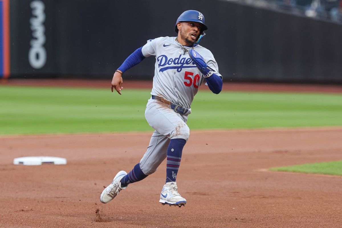 May 25, 2025; New York City, New York, USA;Los Angeles Dodgers shortstop Mookie Betts (50) rounds the bases during a double by first baseman Freddie Freeman (
p)   during the first inning against the New York Mets at Citi Field. Mandatory Credit: Vincent Carchietta-Imagn Images