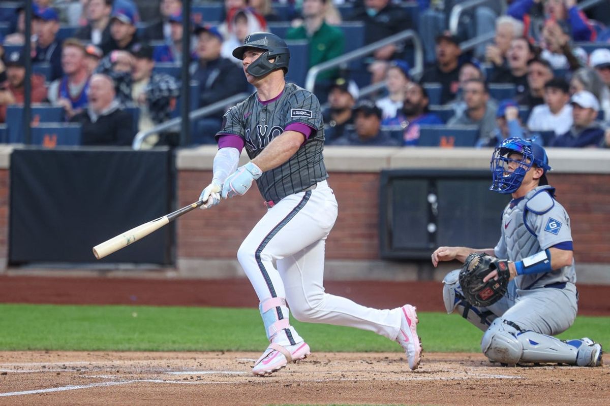 May 25, 2025; New York City, New York, USA; New York Mets first baseman Pete Alonso (20) hits a two run home run during the first inning against the Los Angeles Dodgers at Citi Field. Mandatory Credit: Vincent Carchietta-Imagn Images
