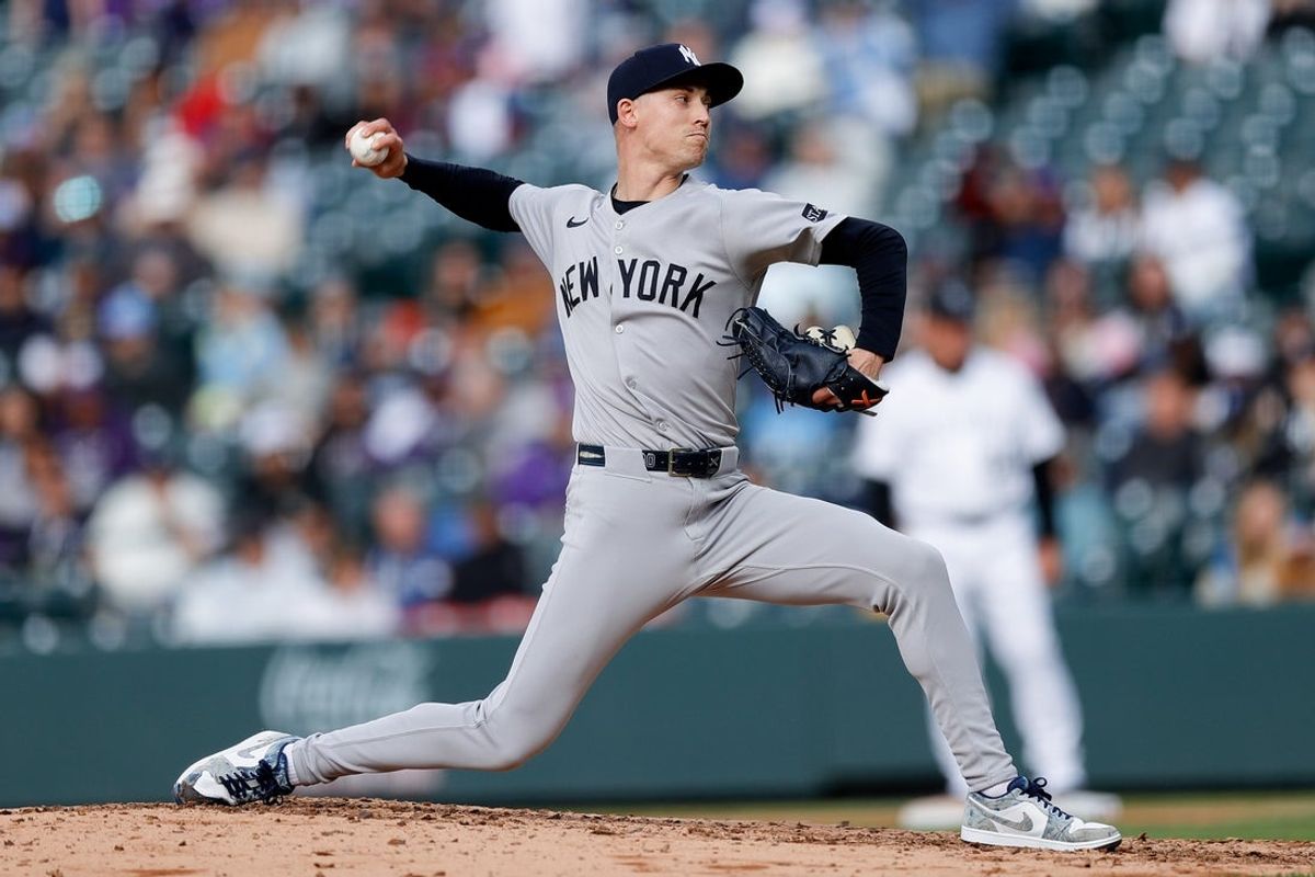 May 25, 2025; Denver, Colorado, USA; New York Yankees relief pitcher Luke Weaver (30) pitches in the ninth inning against the Colorado Rockies at Coors Field. Mandatory Credit: Isaiah J. Downing-Imagn Images
