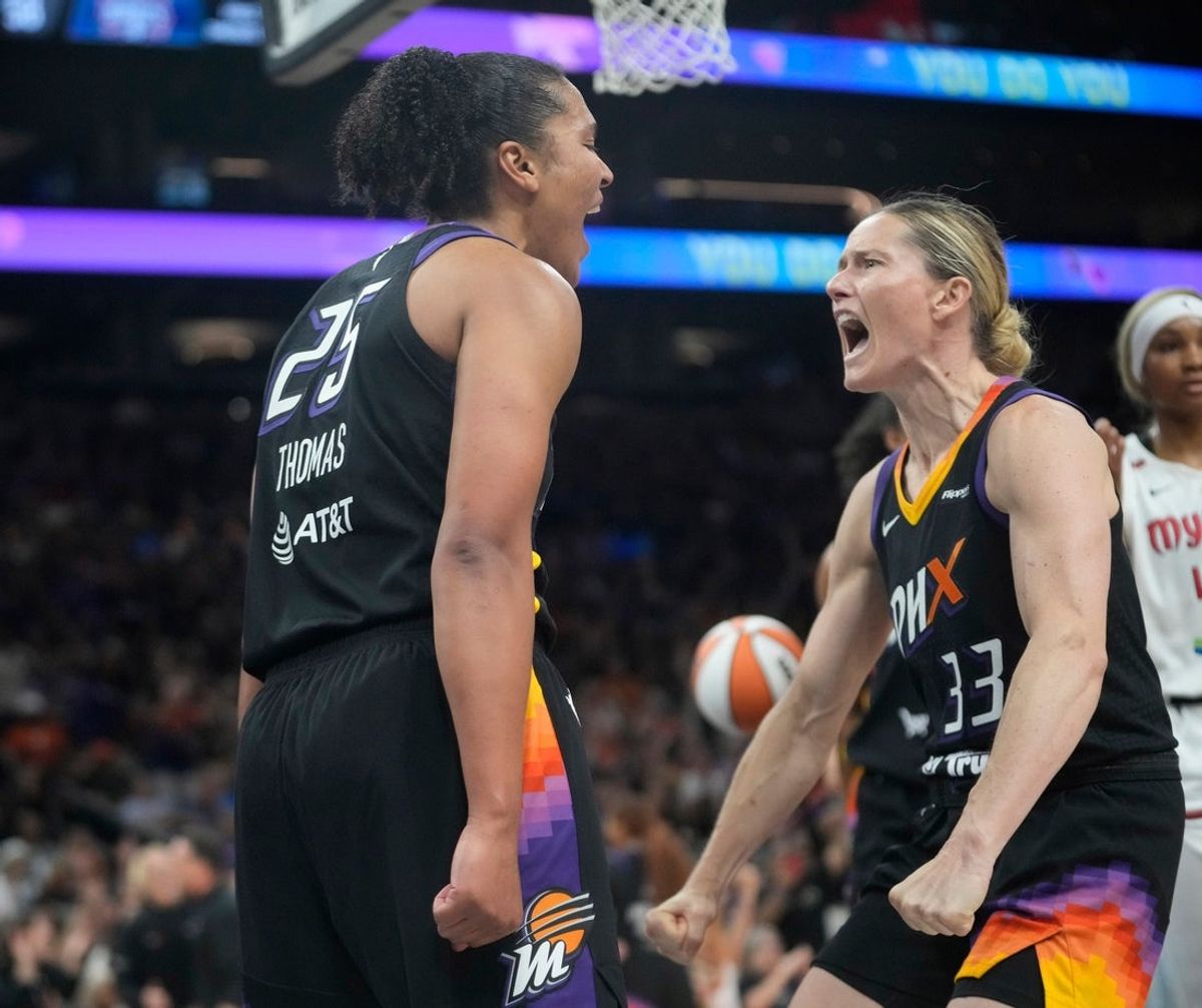 Phoenix Mercury forward Alyssa Thomas (25) celebrates a basket and foul with guard Sami Whitcomb (33) against the Washington Mystics during the fourth quarter at PHX Arena May 25, 2025.