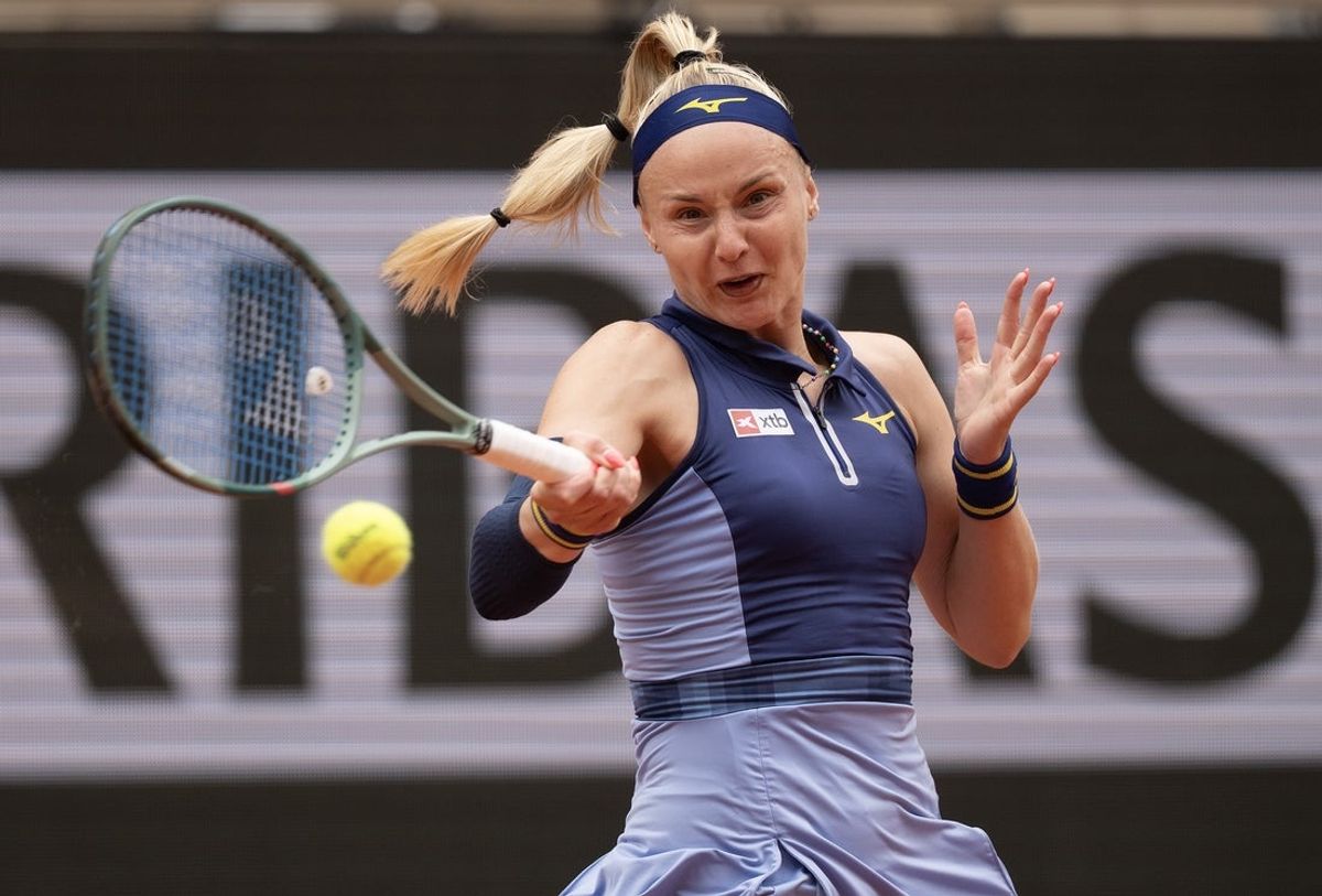 May 26, 2025; Paris, FR; Rebecca Sramkova of Slovakia returns a shot during her match against Iga Swiatek of Poland on day two at Roland Garros Stadium. Mandatory Credit: Susan Mullane-Imagn Images