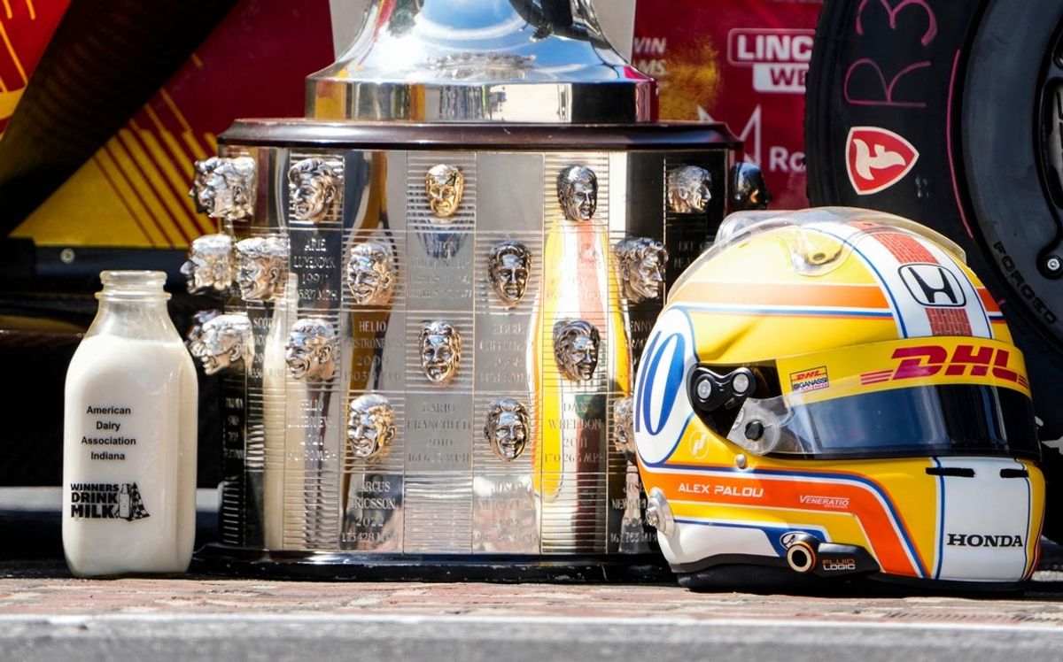 Chip Ganassi Racing driver Alex Palou (10) helmet is seen next to the Borg-Warner trophy Monday, May 26, 2025, after winning the 109th running of the Indianapolis 500 at Indianapolis Motor Speedway.