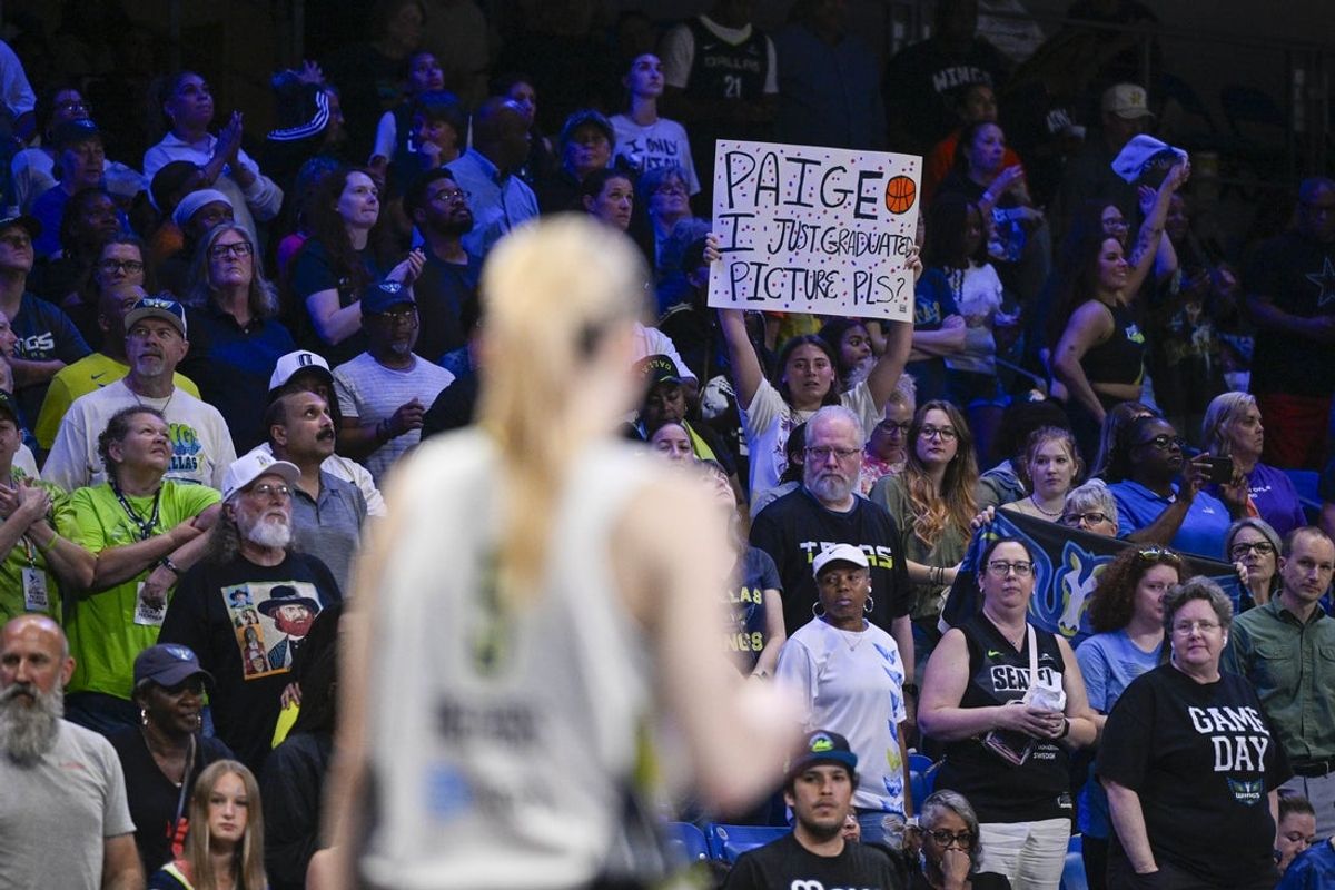 May 19, 2025; Arlington, Texas, USA;  A view of a fan holding a Dallas Wings guard Paige Bueckers (5) sign during the game between the Dallas Wings and the Seattle Storm at College Park Center. Mandatory Credit: Jerome Miron-Imagn Images
