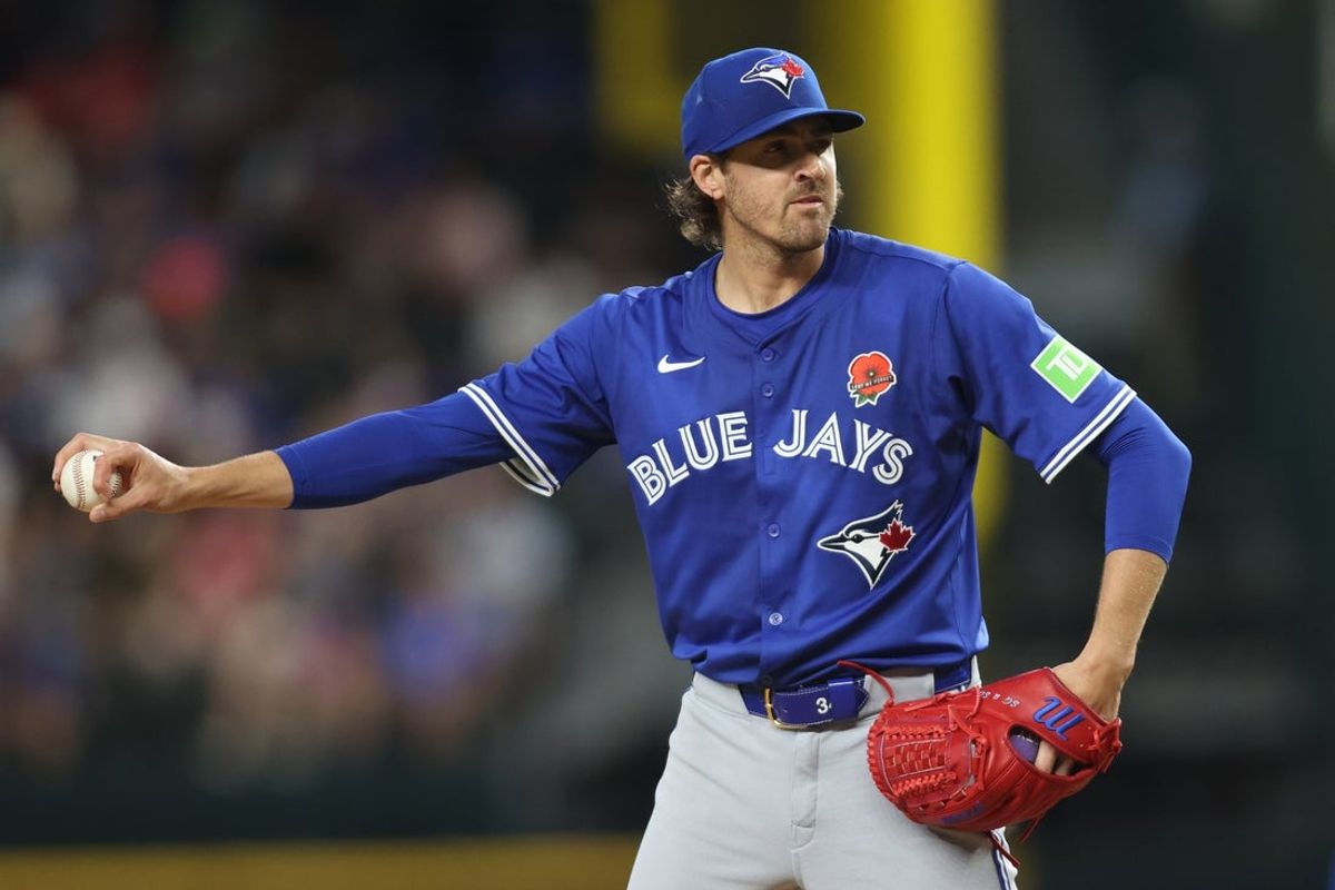 May 26, 2025; Arlington, Texas, USA; Toronto Blue Jays pitcher Kevin Gausman (34) gets ready to throw a pitch during the sixth inning against the Texas Rangers at Globe Life Field. Mandatory Credit: Tim Heitman-Imagn Images
