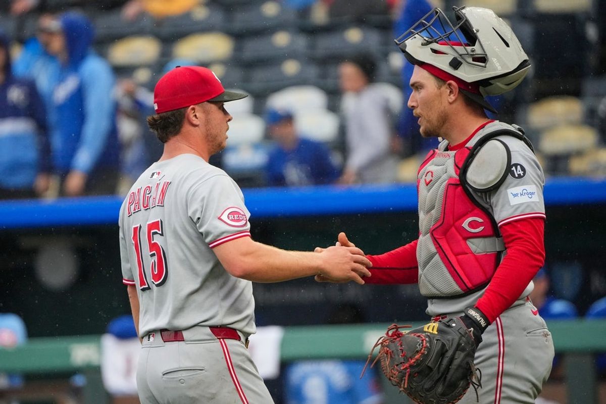 May 26, 2025; Kansas City, Missouri, USA; Cincinnati Reds pitcher Emilio Pagán (15) celebrates with catcher Tyler Stephenson (37) after the win over the Kansas City Royals at Kauffman Stadium. Mandatory Credit: Denny Medley-Imagn Images