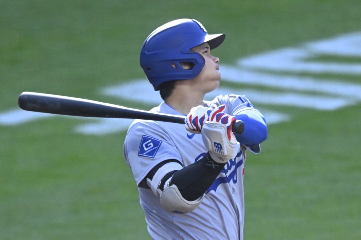 May 26, 2025; Cleveland, Ohio, USA;  Los Angeles Dodgers designated hitter Shohei Ohtani (17) hits a home run on the first pitch of the game in the first inning against the Cleveland Guardians at Progressive Field. Mandatory Credit: David Richard-Imagn Images