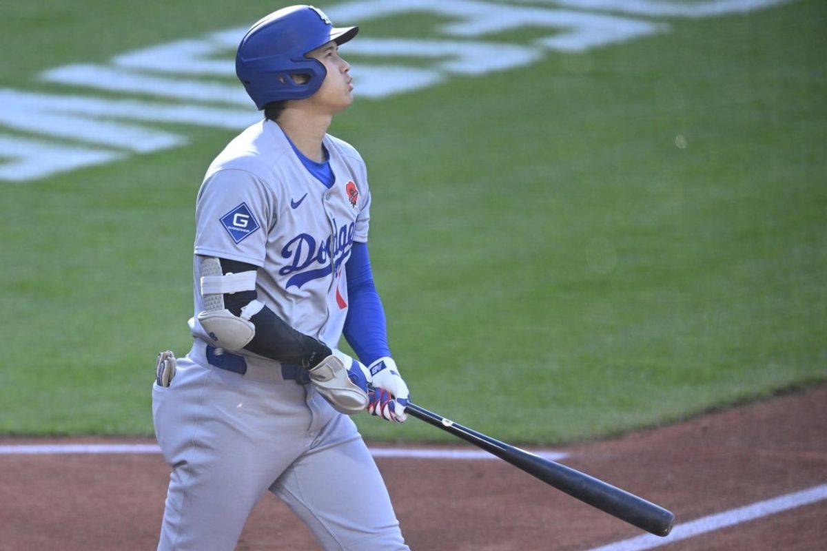 May 26, 2025; Cleveland, Ohio, USA; Los Angeles Dodgers designated hitter Shohei Ohtani (17) watches his solo home run in the first inning against the Cleveland Guardians at Progressive Field. Mandatory Credit: David Richard-Imagn Images