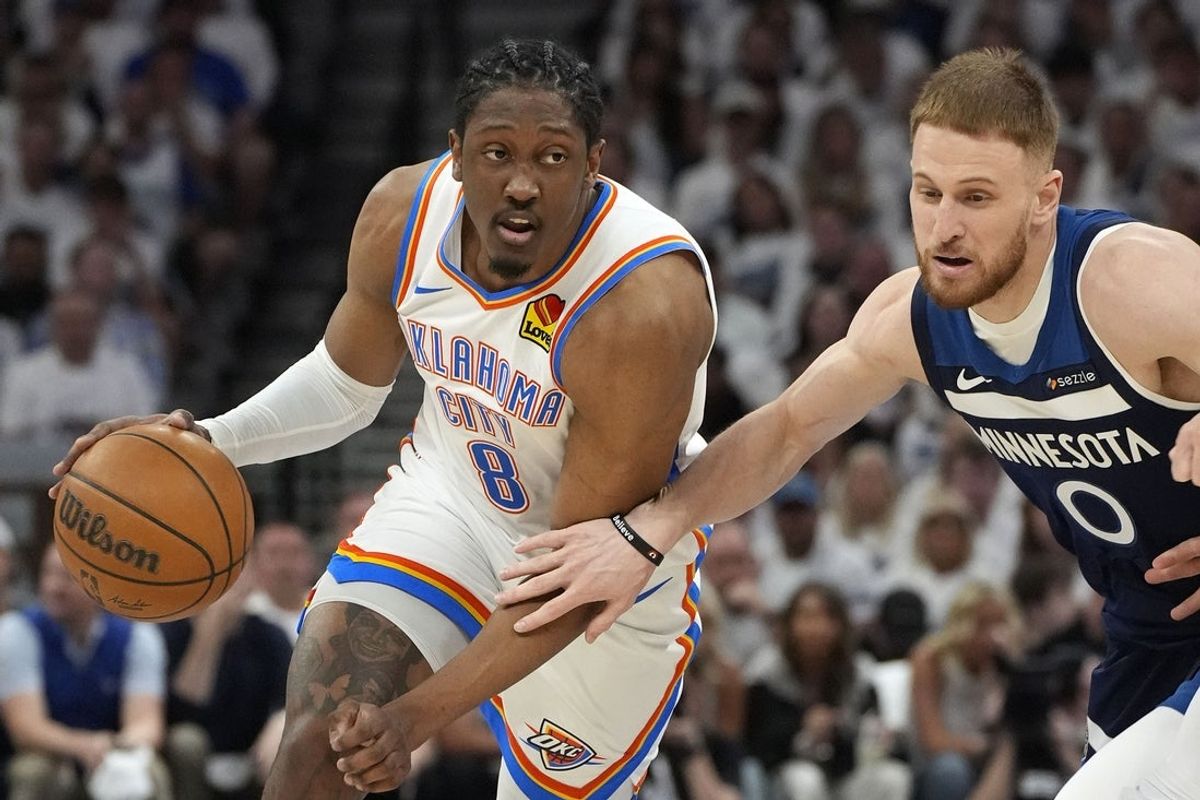May 26, 2025; Minneapolis, Minnesota, USA; Oklahoma City Thunder forward Jalen Williams (8) dribbles the ball past Minnesota Timberwolves guard Donte DiVincenzo (0) in the first half during game four of the western conference finals for the 2025 NBA Playoffs at Target Center. Mandatory Credit: Bruce Kluckhohn-Imagn Images