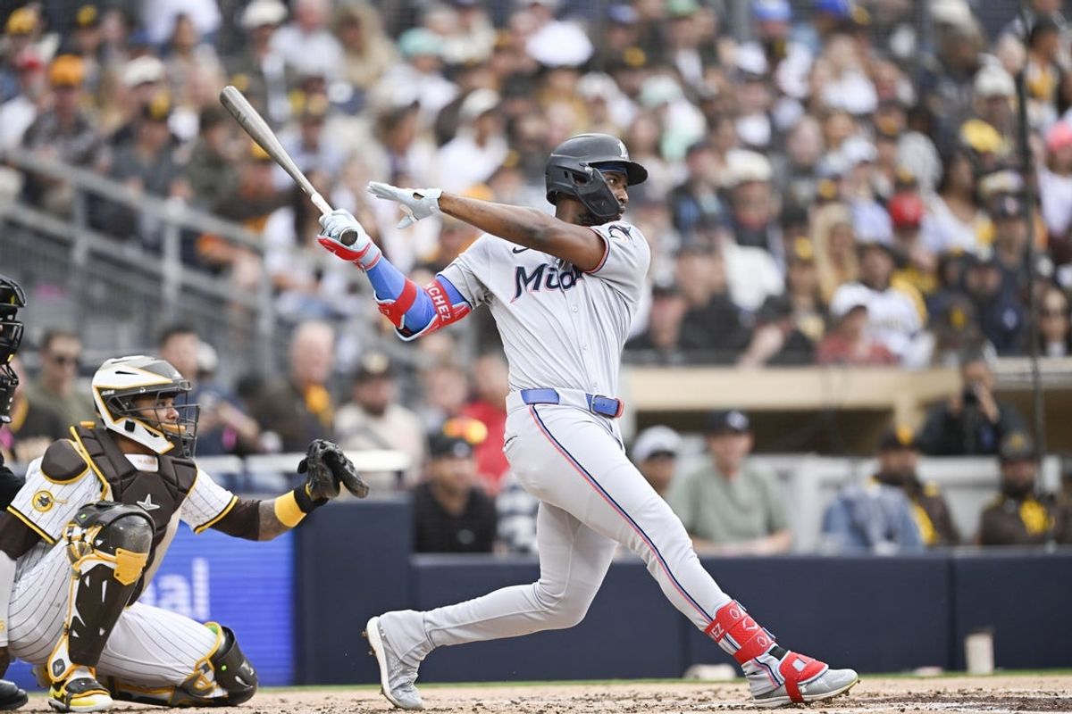 May 26, 2025; San Diego, California, USA;  Miami Marlins right fielder Jesus Sanchez (7) hits a solo home run during the second inning against the San Diego Padres at Petco Park. Mandatory Credit: Denis Poroy-Imagn Images