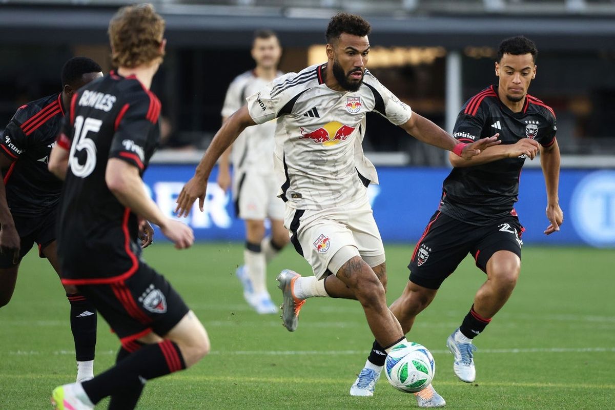 May 24, 2025; Washington, District of Columbia, USA; New York Red Bulls forward Eric Maxim Choupo-Moting (13) dribbles the ball past D.C. United defender Kye Rowles (15) and D.C. United midfielder Brandon Servania (23) during the first half at Audi Field. Mandatory Credit: Daniel Kucin Jr.-Imagn Images