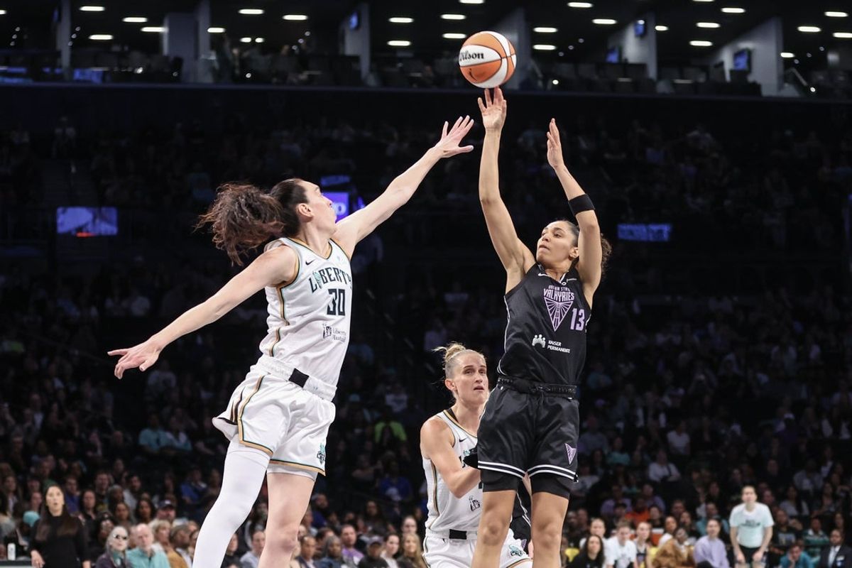 May 27, 2025; Brooklyn, New York, USA;  Golden State Valkyries forward Janelle Salaun (13) takes a three point shot past New York Liberty forward Breanna Stewart (30) in the first quarter at Barclays Center. Mandatory Credit: Wendell Cruz-Imagn Images