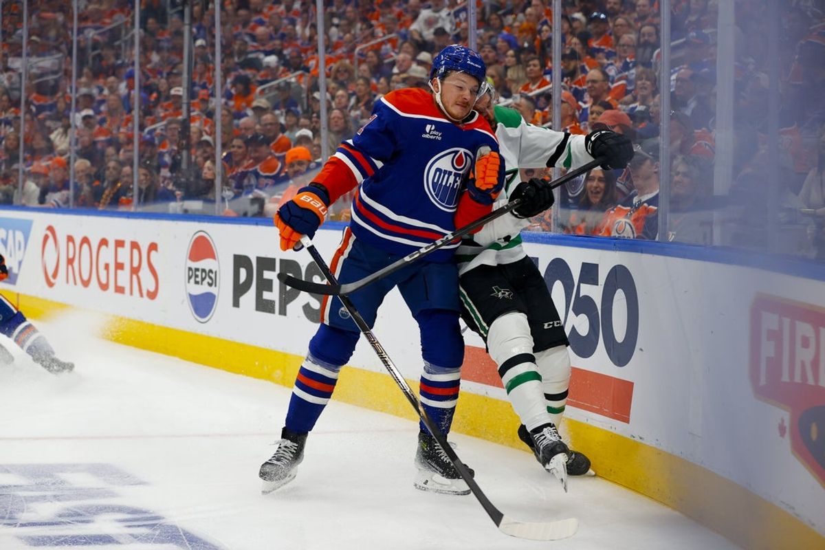 May 27, 2025; Edmonton, Alberta, CAN; Edmonton Oilers center Trent Frederic (21) chases the puck during the first period against the Dallas Stars in game four of the Western Conference Final of the 2025 Stanley Cup Playoffs at Rogers Place. Mandatory Credit: Perry Nelson-Imagn Images