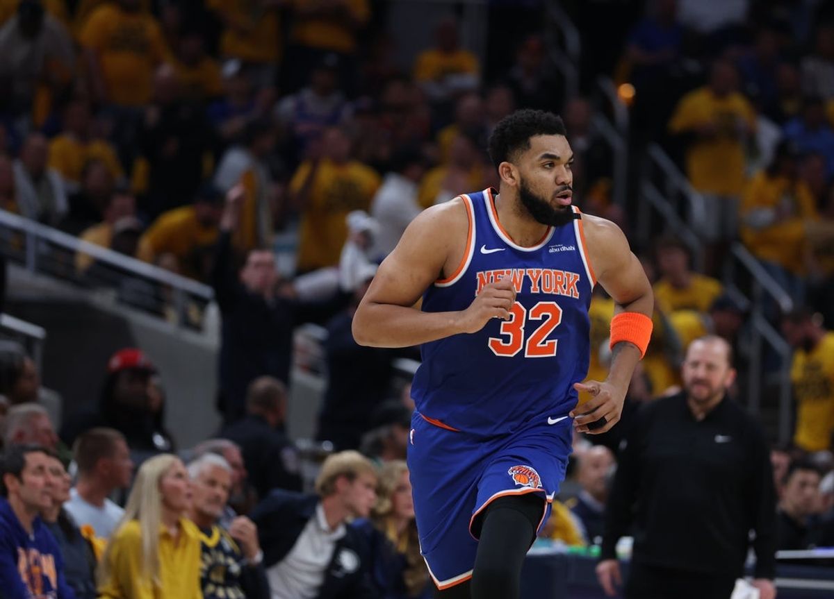 May 27, 2025; Indianapolis, Indiana, USA; New York Knicks center Karl-Anthony Towns (32) runs up court during the second quarter against the Indiana Pacers during game four of the eastern conference finals for the 2025 NBA Playoffs at Gainbridge Fieldhouse. Mandatory Credit: Trevor Ruszkowski-Imagn Images