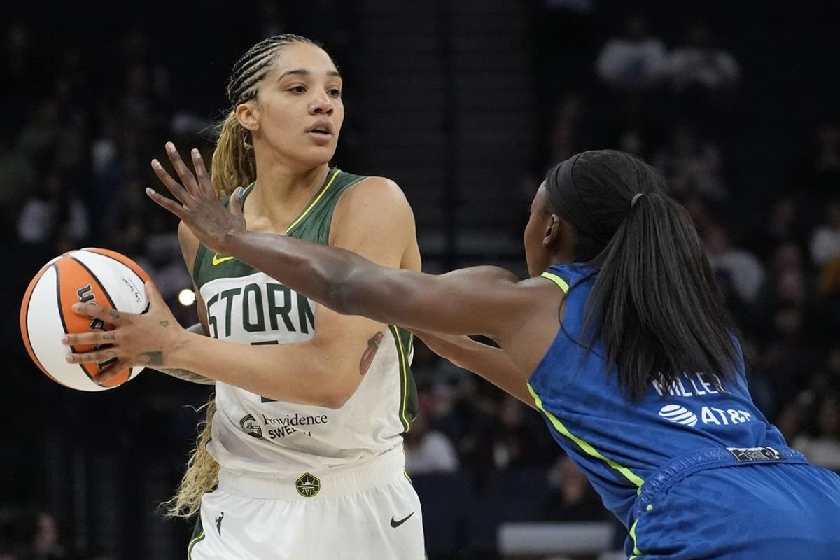 May 27, 2025; Minneapolis, Minnesota, USA; Seattle Storm forward Gabby Williams (5) works around Minnesota Lynx forward Diamond Miller (1) in the second quarter at Target Center. Mandatory Credit: Bruce Kluckhohn-Imagn Images