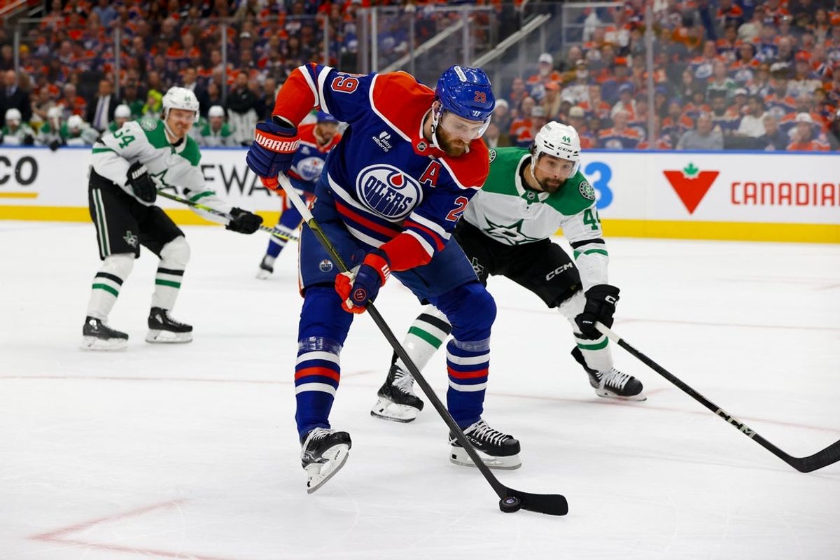 May 27, 2025; Edmonton, Alberta, CAN; Edmonton Oilers center Leon Draisaitl (29) skates with the puck past Dallas Stars defenseman Cody Ceci (44) during the first period in game four of the Western Conference Final of the 2025 Stanley Cup Playoffs at Rogers Place. Mandatory Credit: Perry Nelson-Imagn Images