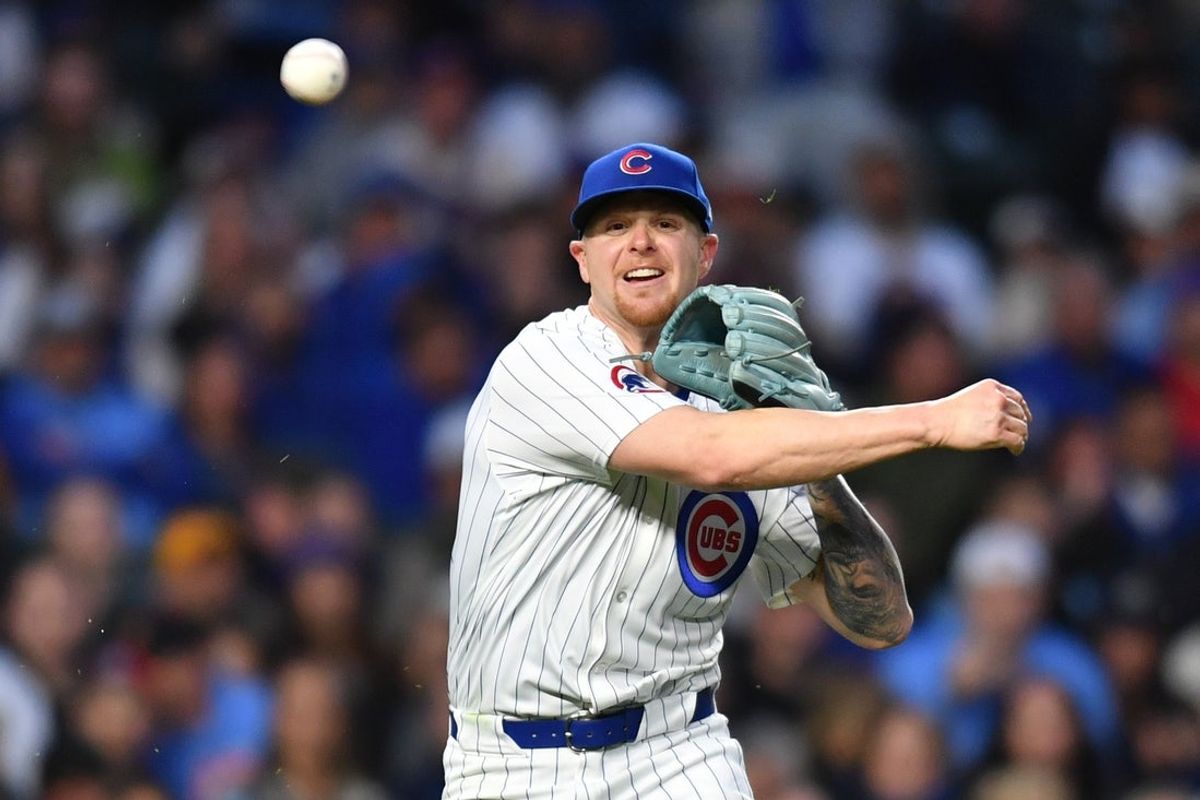 May 27, 2025; Chicago, Illinois, USA; Chicago Cubs starting pitcher Cade Horton (22) throws to first base during the fourth inning against the Colorado Rockies at Wrigley Field. Mandatory Credit: Patrick Gorski-Imagn Images
