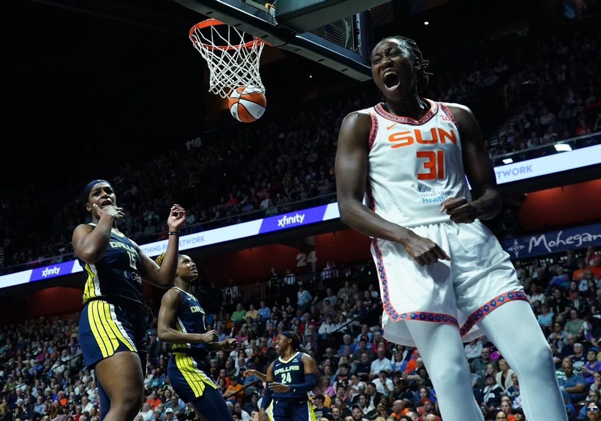 May 27, 2025; Uncasville, Connecticut, USA;  Connecticut Sun center Tina Charles (31) reacts after her packet and one against Dallas Wings center Teaira McCowan (15) in the second half at Mohegan Sun Arena. Mandatory Credit: David Butler II-Imagn Images