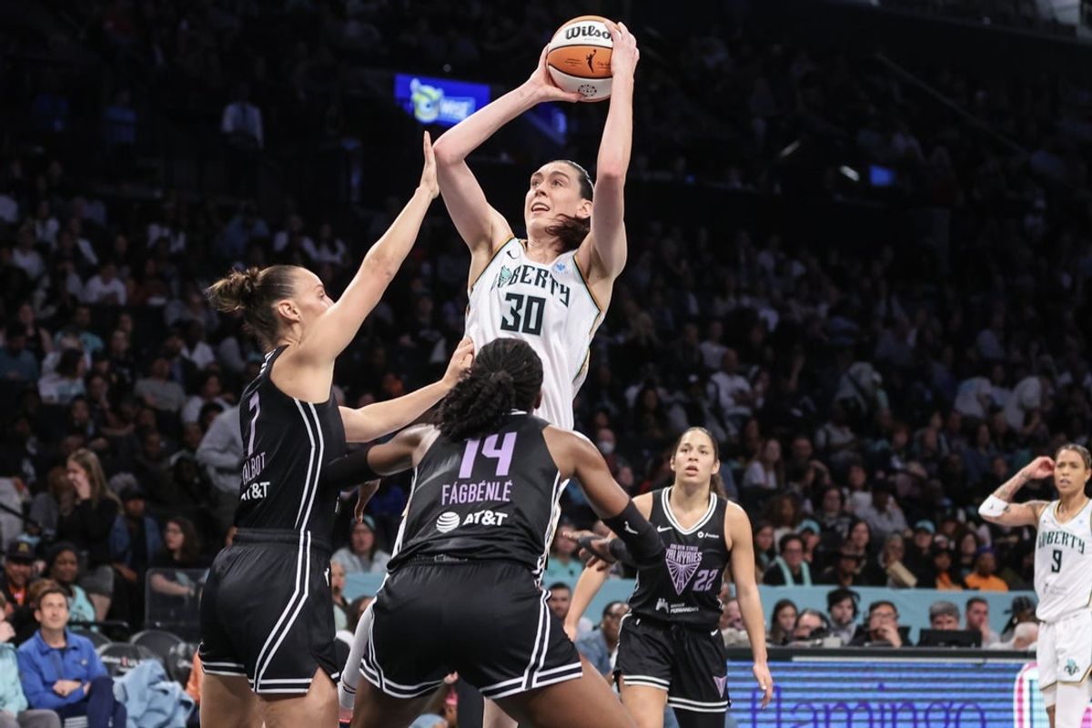 May 27, 2025; Brooklyn, New York, USA;  New York Liberty forward Breanna Stewart (30) shoots over Golden State Valkyries forward Stephanie Talbot (7) and center Temi Fagbenle (14) in the third quarter at Barclays Center. Mandatory Credit: Wendell Cruz-Imagn Images