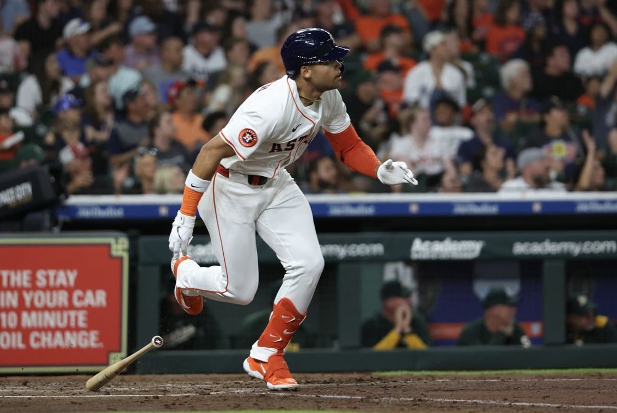 May 27, 2025; Houston, Texas, USA ; Houston Astros right fielder Cam Smith (11) hits a two-RBI double against the Athletics in the third inning at Daikin Park. Mandatory Credit: Thomas Shea-Imagn Images
