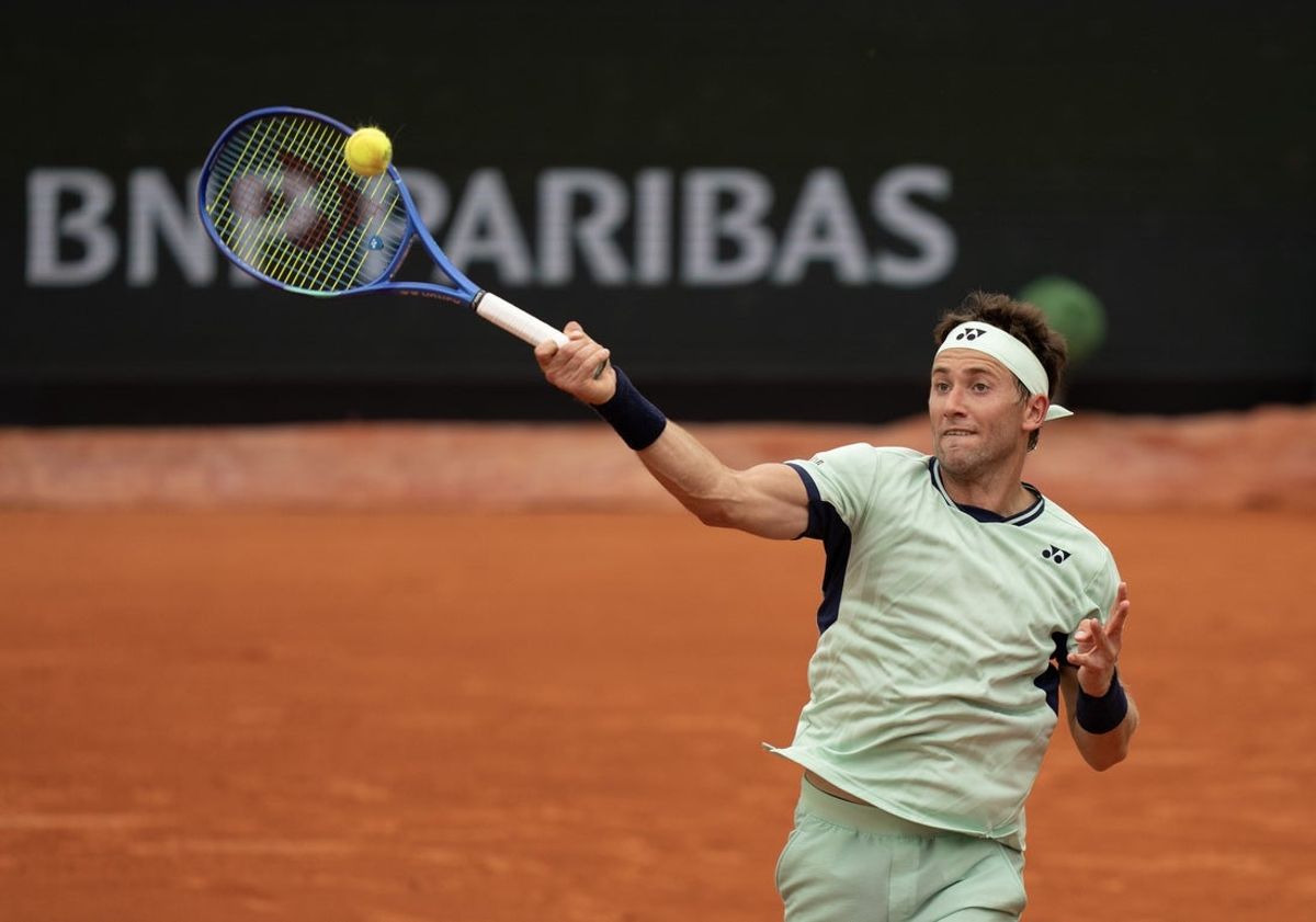 May 28, 2025; Paris, FR; Casper Ruud of Norway returns a shot during his match against Nuno Borges of Portugal on day four at Roland Garros Stadium.  Mandatory Credit: Susan Mullane-Imagn Images