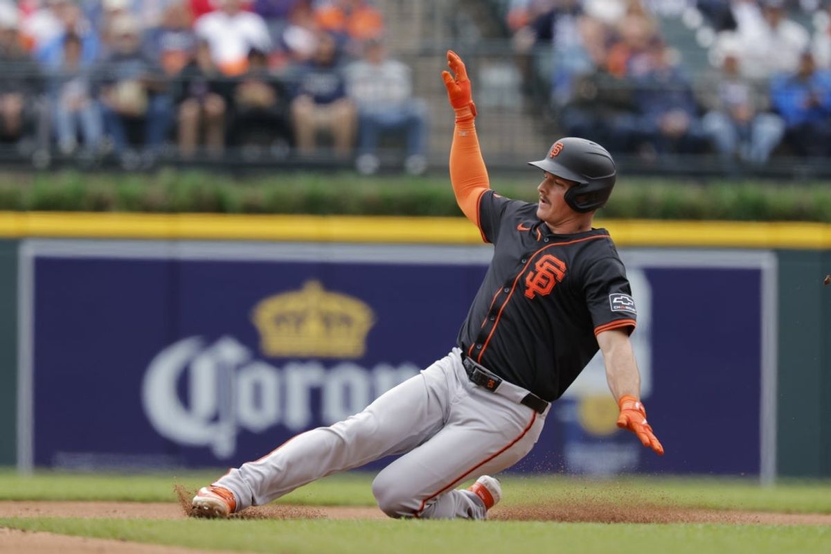 May 28, 2025; Detroit, Michigan, USA;  San Francisco Giants third base Matt Chapman (26) slides into second after he hits a double in the fourth inning against the Detroit Tigers at Comerica Park. Mandatory Credit: Rick Osentoski-Imagn Images
