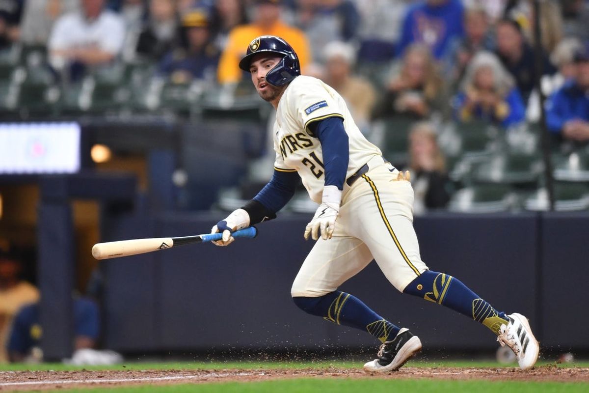 May 28, 2025; Milwaukee, Wisconsin, USA; Milwaukee Brewers third baseman Caleb Durbin (21) hits a two run double during the sixth inning against the Boston Red Sox at American Family Field. Mandatory Credit: Patrick Gorski-Imagn Images
