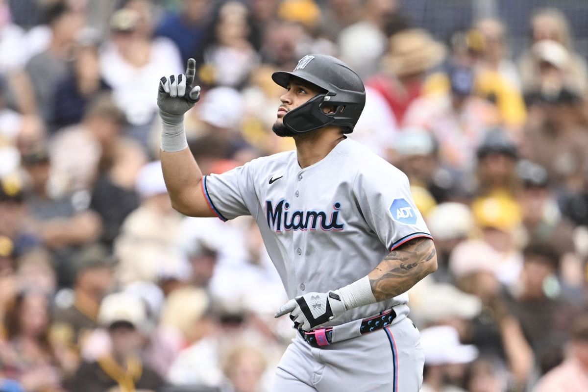 May 28, 2025; San Diego, California, USA; Miami Marlins catcher Agustin Ramirez (50) points skyward after hitting a solo home run during the third inning against the San Diego Padres at Petco Park. Mandatory Credit: Denis Poroy-Imagn Images