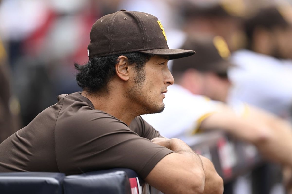 May 28, 2025; San Diego, California, USA; San Diego Padres pitcher Yu Darvish (1) looks out from the dugout during the third inning against the Miami Marlins at Petco Park. Mandatory Credit: Denis Poroy-Imagn Images