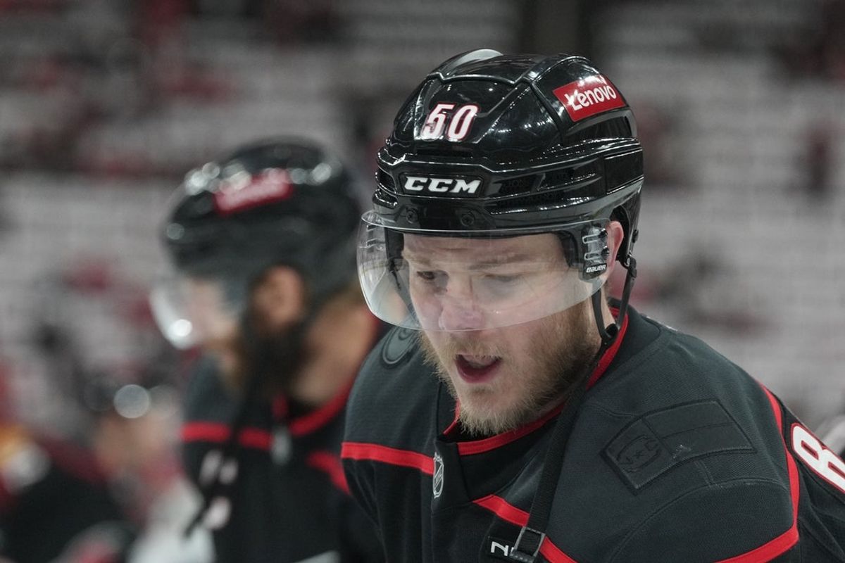 May 28, 2025; Raleigh, North Carolina, USA; Carolina Hurricanes forward Eric Robinson (50) warms up prior to the game against the Florida Panthers in game five of the Eastern Conference Final of the 2025 Stanley Cup Playoffs at Lenovo Center. Mandatory Credit: James Guillory-Imagn Images
