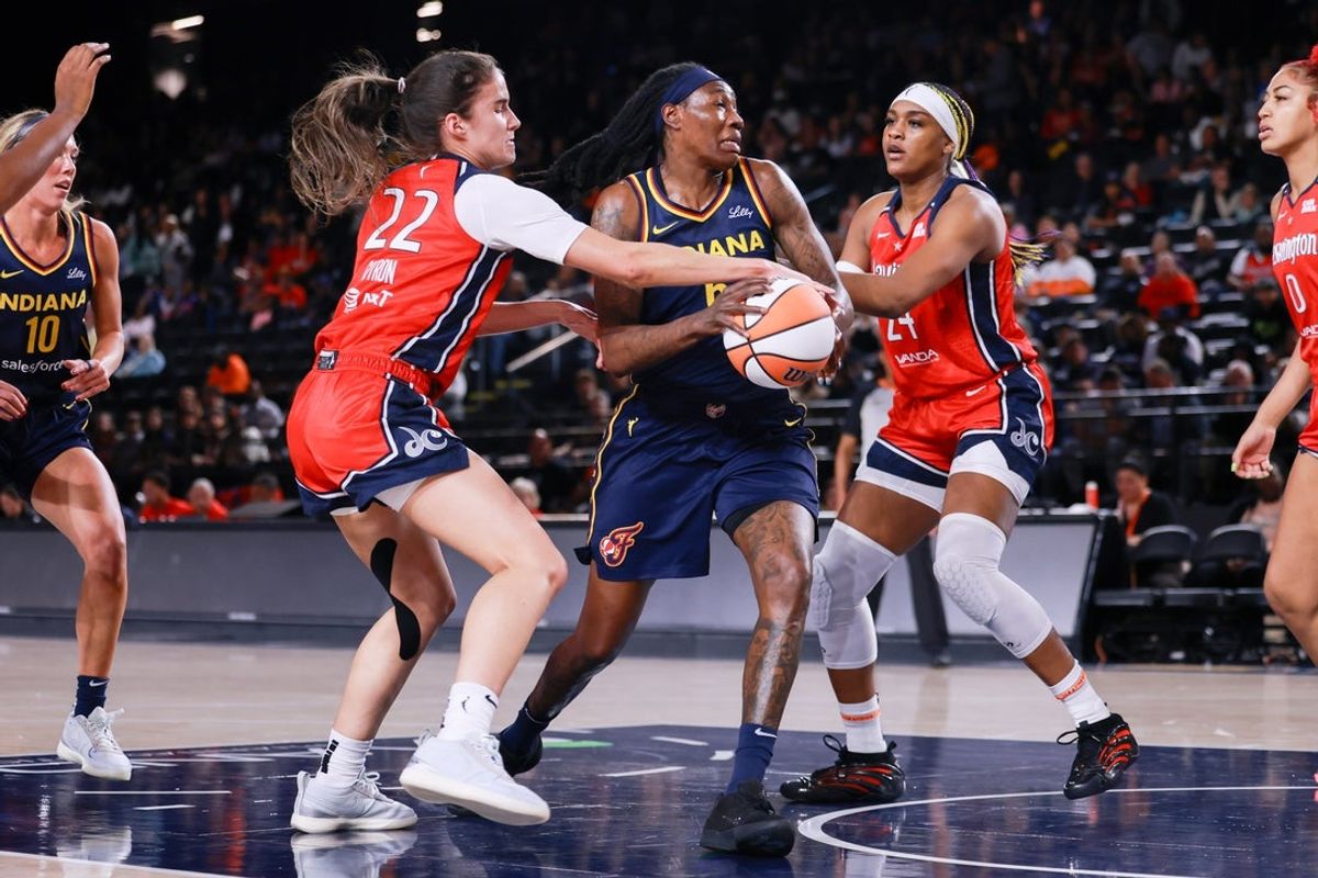May 28, 2025; Washington, District of Columbia, USA; Indiana Fever forward Natasha Howard (6) controls the ball as Washington Mystics guard Sonia Citron (22) and Washington Mystics forward Aaliyah Edwards (24) defend in the first quarter at Entertainment & Sports Arena. Mandatory Credit: Emily Faith Morgan-Imagn Images