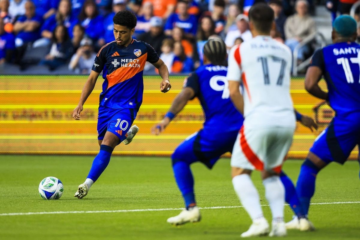 May 28, 2025; Cincinnati, Ohio, USA; FC Cincinnati midfielder Evander (10) kicks the ball against FC Dallas in the first half at TQL Stadium. Mandatory Credit: Katie Stratman-Imagn Images