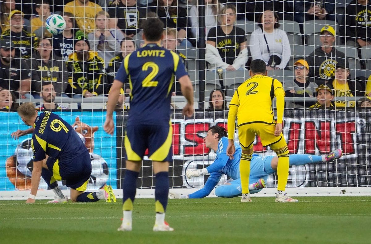 Columbus Crew goalkeeper Nicholas Hagen (1) can't come up with the save as Nashville SC forward Sam Surridge (9) scores in the first half during their MLS game at Lower.com Field on May 28, 2025.