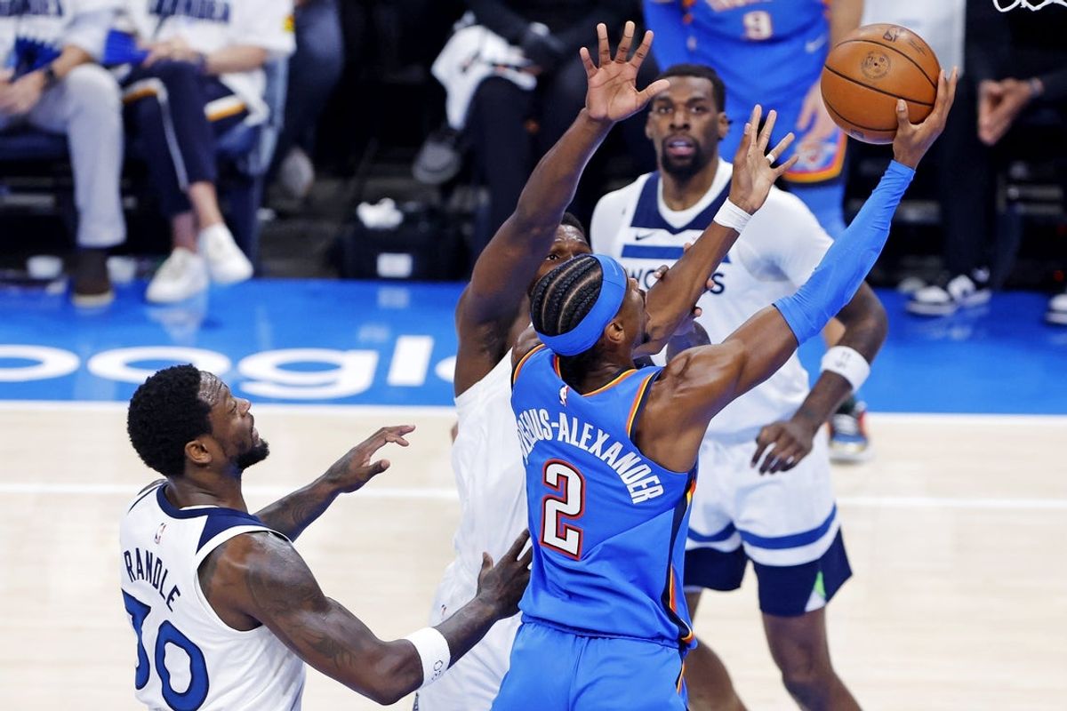May 28, 2025; Oklahoma City, Oklahoma, USA; Oklahoma City Thunder guard Shai Gilgeous-Alexander (2) shoots the ball against Minnesota Timberwolves forward Julius Randle (30) during the first quarter in game five of the western conference finals for the 2025 NBA Playoffs at Paycom Center. Mandatory Credit: Alonzo Adams-Imagn Images