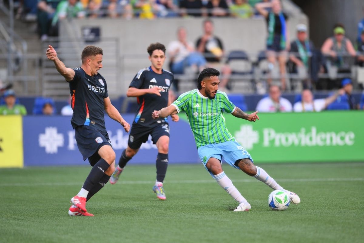 May 28, 2025; Seattle, Washington, USA; Seattle Sounders FC forward Jesus Ferreira (9) scores a goal past San Diego FC defender Christopher McVey (97) during the second half at Lumen Field. Mandatory Credit: Steven Bisig-Imagn Images