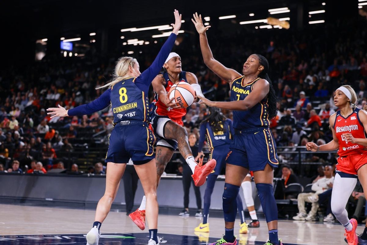 May 28, 2025; Washington, District of Columbia, USA; Washington Mystics guard Brittney Sykes (20) battles for the ball with Indiana Fever guard Sophie Cunningham (8) and Indiana Fever forward Aliyah Boston (7) at Entertainment & Sports Arena. Mandatory Credit: Emily Faith Morgan-Imagn Images
