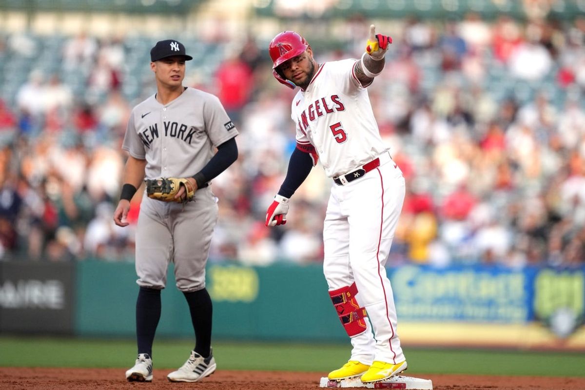 May 28, 2025; Anaheim, California, USA; Los Angeles Angels third baseman Yoan Moncada (5) gestures after hitting a double in the first inning against the New York Yankees at Angel Stadium. Mandatory Credit: Kirby Lee-Imagn Images