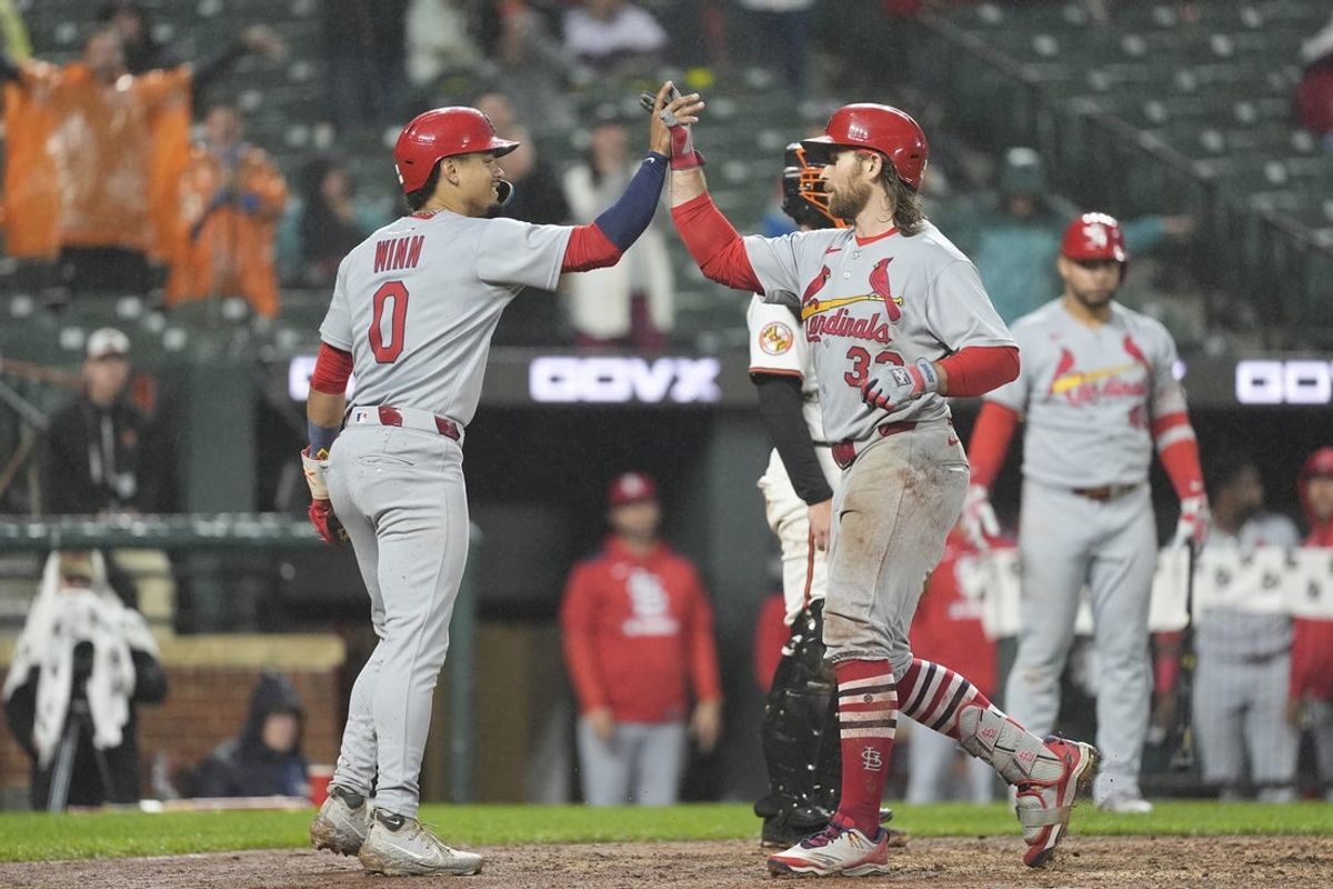 May 28, 2025; Baltimore, Maryland, USA; St. Louis Cardinals shortstop Masyn Winn (0) congratulates St. Louis Cardinals second baseman Brendan Donovan (33) for hitting a two run home run against the Baltimore Orioles during the fifth inning at Oriole Park at Camden Yards. Mandatory Credit: Gregory Fisher-Imagn Images