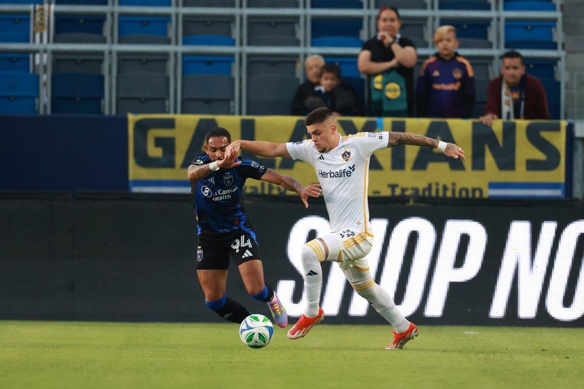 May 28, 2025; Carson, California, USA;  LA Galaxy forward Gabriel Pec (11) controls the ball against San Jose Earthquakes defender Vitor Costa (94) during the first half at Dignity Health Sports Park. Mandatory Credit: Kiyoshi Mio-Imagn Images