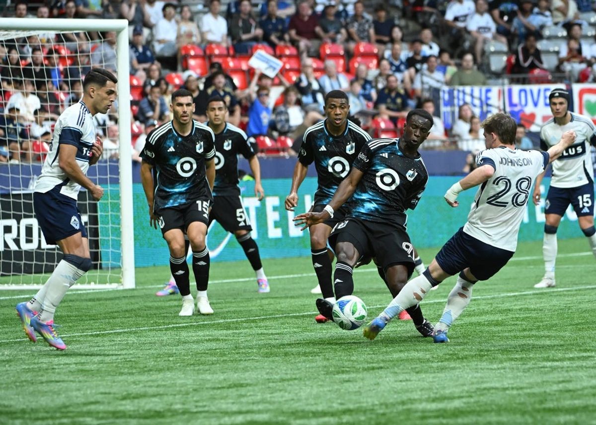 May 28, 2025; Vancouver, British Columbia, CAN; Minnesota United forward Kelvin Yeboah (9) stops a shot on goal from Vancouver Whitecaps FC defender Tate Johnson (28) during the first half at BC Place. Mandatory Credit: Simon Fearn-Imagn Images