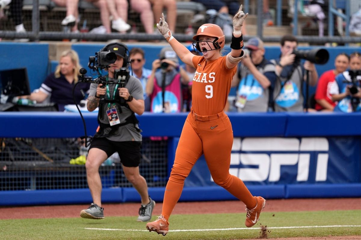 Texas infielder Joley Mitchell (9) celebrates after hitting a home run in the second inning of a Women's College World Series softball game between the Texas Longhorns and the Florida Gators at Devon Park in Oklahoma City, Thursday, May 29, 2025.