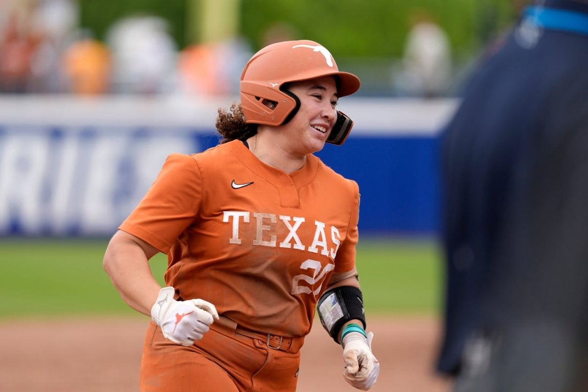 Texas utility Katie Stewart (20) runs home after hitting a home run in the sixth inning of a Women's College World Series softball game between the Texas Longhorns and the Florida Gators at Devon Park in Oklahoma City, Thursday, May 29, 2025.