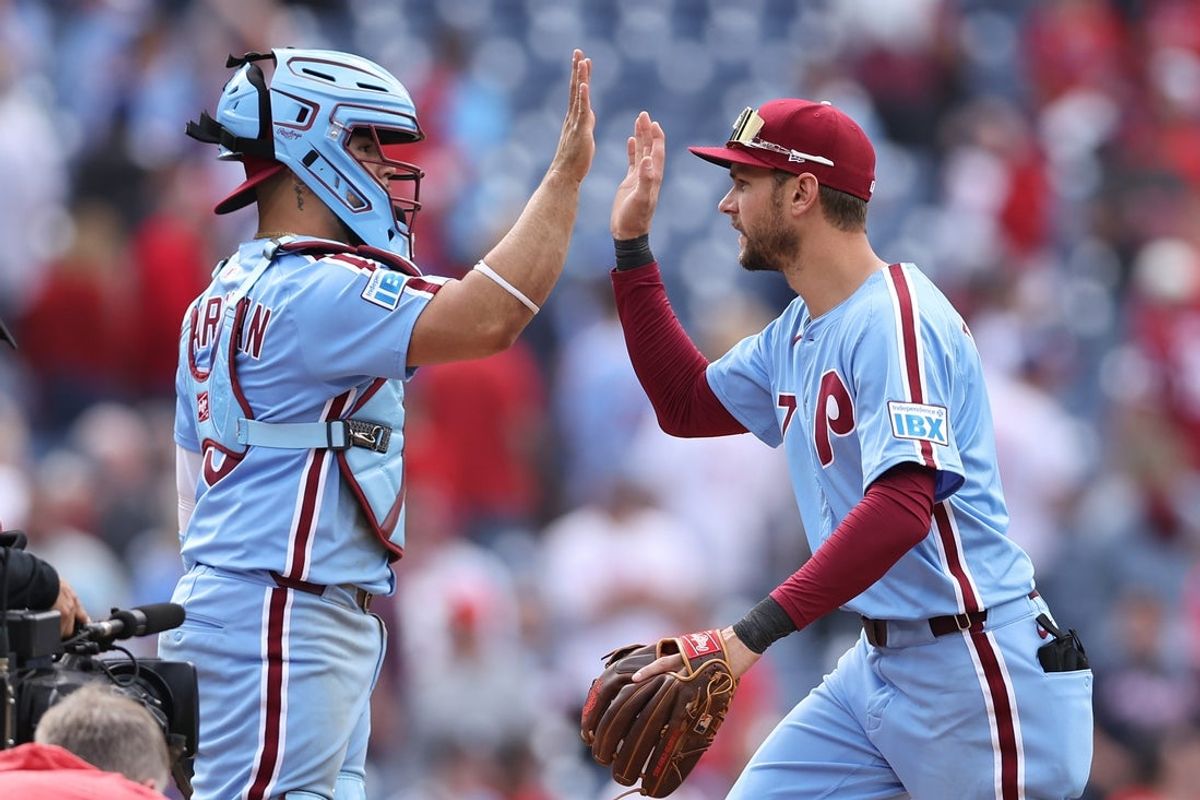 May 29, 2025; Philadelphia, Pennsylvania, USA; Philadelphia Phillies shortstop Trea Turner (7) and catcher Rafael Marchán (13) high five after a victory against the Atlanta Braves at Citizens Bank Park. Mandatory Credit: Bill Streicher-Imagn Images