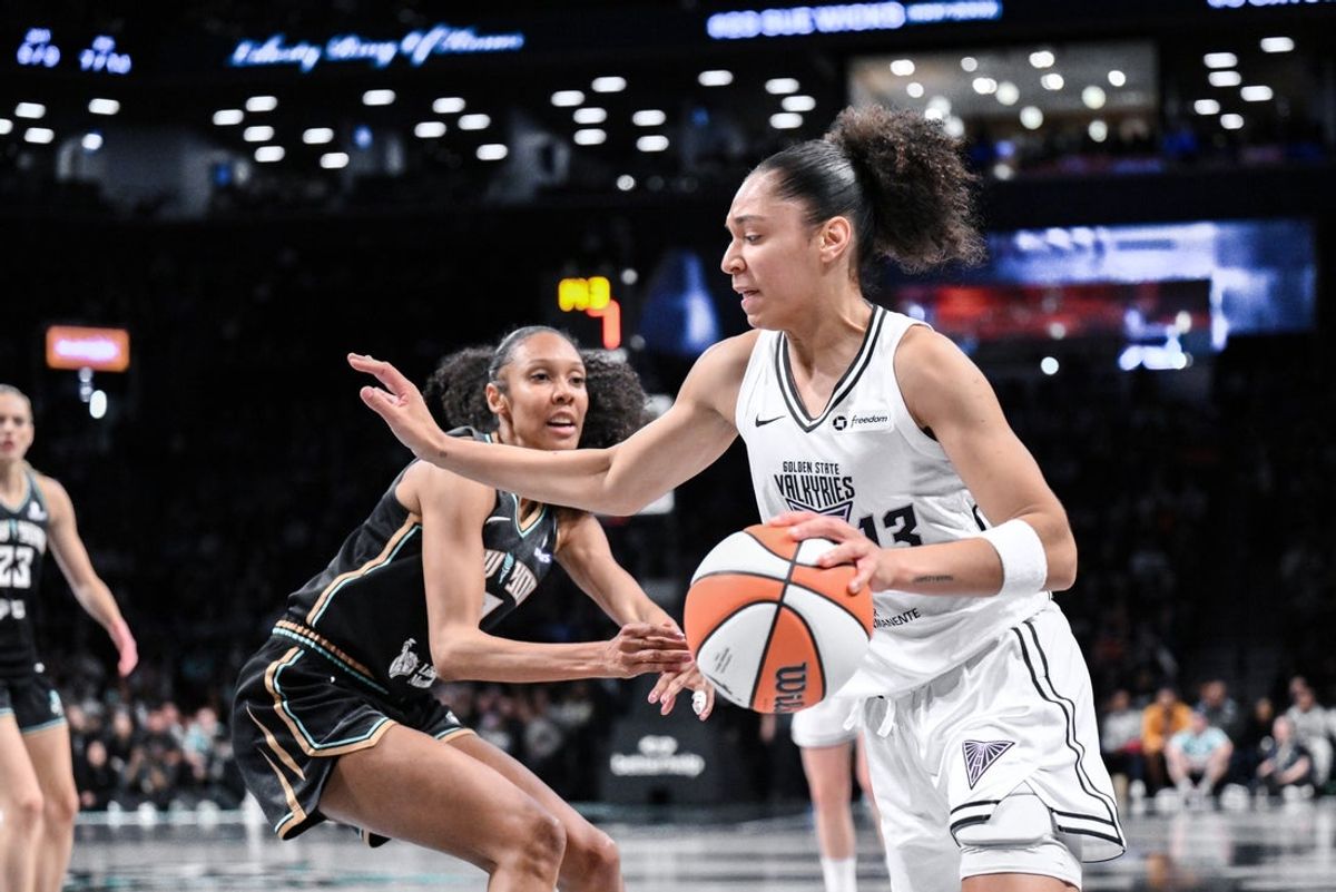 May 29, 2025; Brooklyn, New York, USA; Golden State Valkyries forward Janelle Salaun (13) drives past New York Liberty guard Rebekah Gardner (7) during the first half at Barclays Center. Mandatory Credit: John Jones-Imagn Images