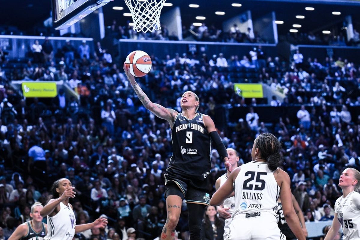 May 29, 2025; Brooklyn, New York, USA; New York Liberty guard Natasha Cloud (9) drives to the basket while being defended by Golden State Valkyries forward Monique Billings (25) during the second half at Barclays Center. Mandatory Credit: John Jones-Imagn Images