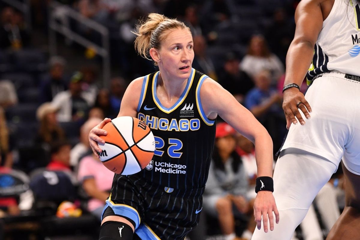 May 29, 2025; Chicago, Illinois, USA; Chicago Sky guard Courtney Vandersloot (22) controls the ball during the second half against the Dallas Wings at the Wintrust Arena. Mandatory Credit: Patrick Gorski-Imagn Images