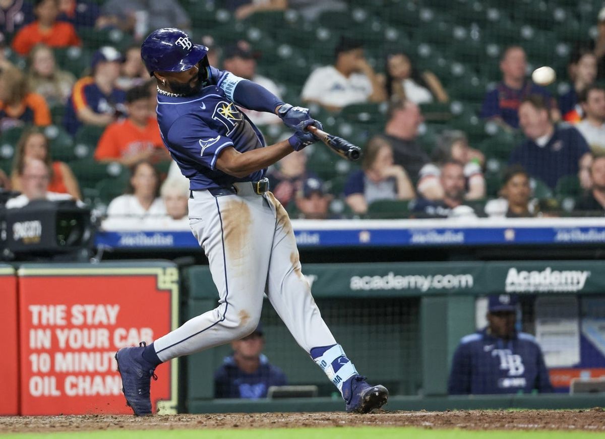 May 29, 2025; Houston, Texas, USA; Tampa Bay Rays third baseman Junior Caminero (13) hits a two run RBI double against the Houston Astros  in the eighth inning at Daikin Park. Mandatory Credit: Thomas Shea-Imagn Images