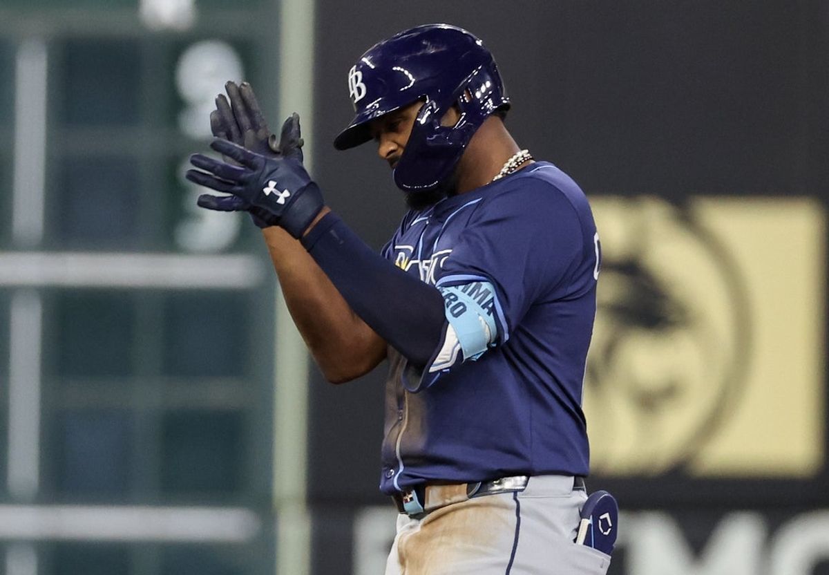May 29, 2025; Houston, Texas, USA; Tampa Bay Rays third baseman Junior Caminero (13) reacts after hitting a two run RBI double against the Houston Astros  in the eighth inning at Daikin Park. Mandatory Credit: Thomas Shea-Imagn Images