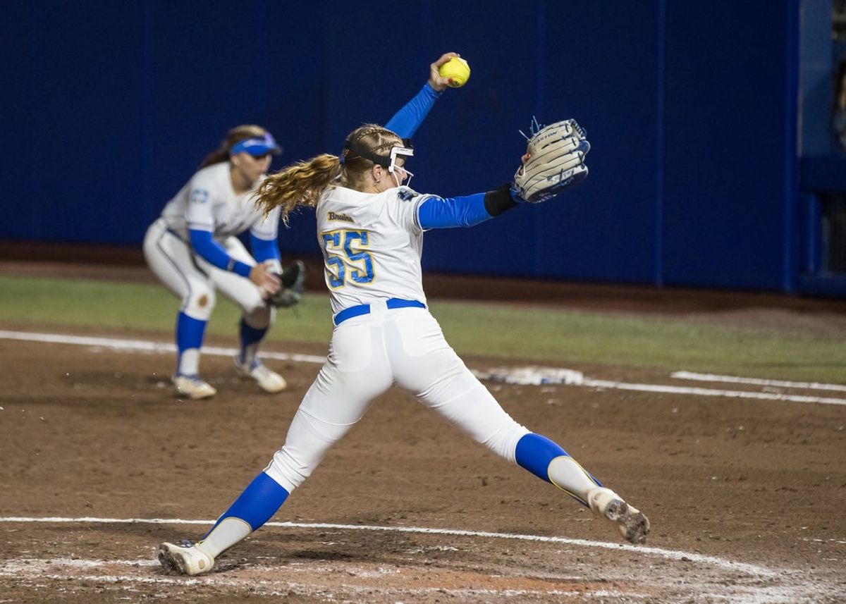 May 29, 2025; Oklahoma City, OK, USA;  UCLA Bruins pitcher Kaitlyn Terry (55) throws a pitch in the second inning against the Oregon Ducks during the NCAA Softball Women's College World Series at Devon Park. Mandatory Credit: Brett Rojo-Imagn Images